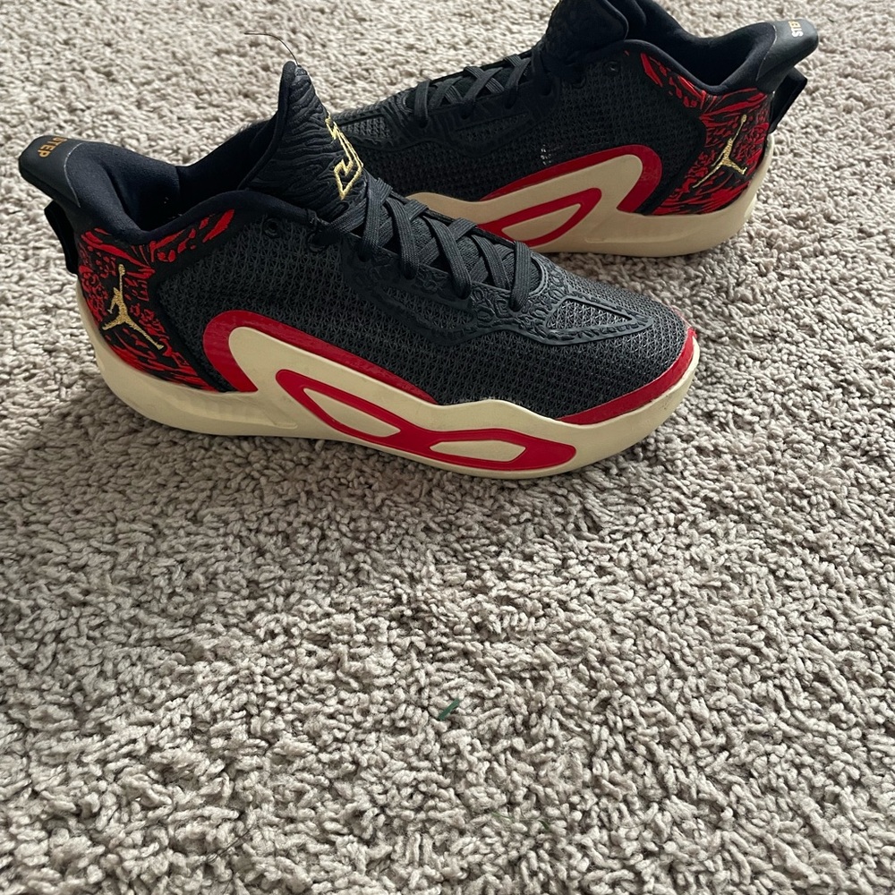 Air Jordan XXXVI Black and Red Sneakers with Cream Accents